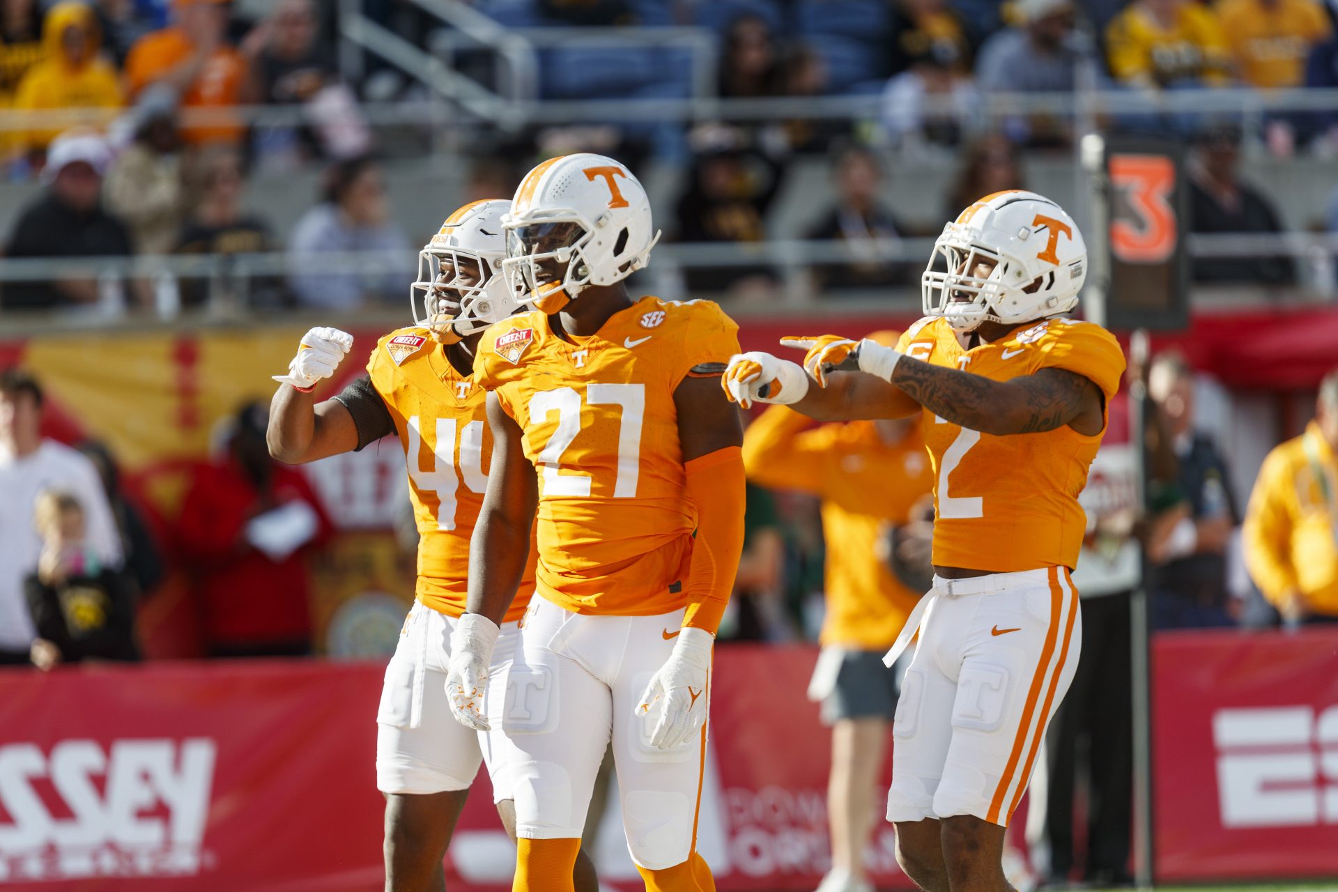 Jan 1, 2024; Orlando, FL, USA; Tennessee Volunteers defensive lineman James Pearce Jr. (27), linebacker Elijah Herring (44) and defensive back Jaylen McCollough (2) celebrate a sack against the Iowa Hawkeyes during the third quarter at Camping World Stadium. Mandatory Credit: Morgan Tencza-USA TODAY Sports