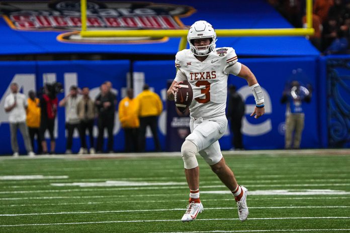 Texas Longhorns quarterback Quinn Ewers (3) runs the ball during the Sugar Bowl College Football Playoff semifinals game against the Washington Huskies at the Caesars Superdome on Monday, Jan. 1, 2024 in New Orleans, Louisiana.