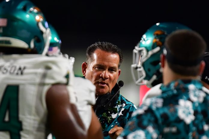 Dec 23, 2023; Honolulu, HI, USA; Coastal Carolina Chanticleers head coach Tim Beck talks to his players during the first quarter of the Easypost Hawaii Bowl against the San Jose State Spartans at Clarence T.C. Ching Athletics Complex. Mandatory Credit: Steven Erler-USA TODAY Sports