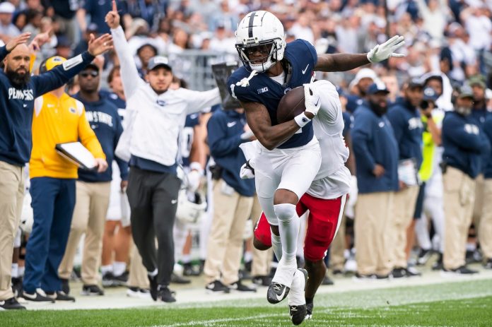 Penn State wide receiver KeAndre Lambert-Smith walks a tightrope along the sideline as he goes the distance on a 57-yard touchdown reception late in the fourth quarter.