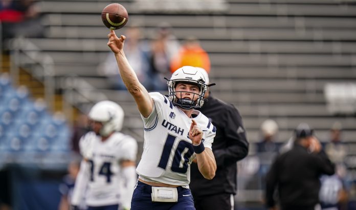 Utah State Aggies quarterback McCae Hillstead (10) warms up before the start of the game against the UConn Huskies at Rentschler Field at Pratt & Whitney Stadium.