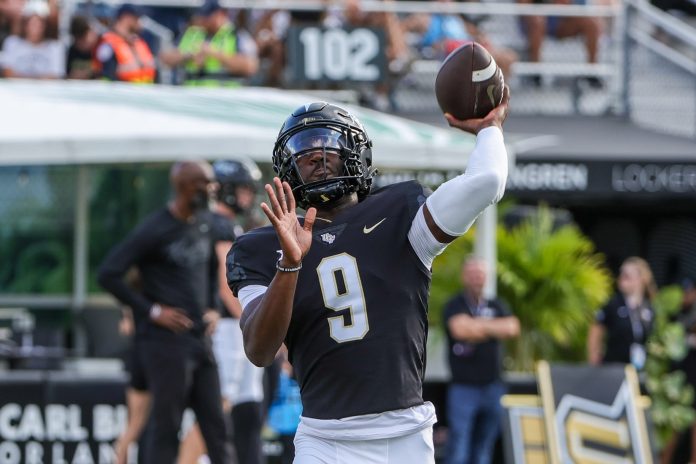 UCF Knights quarterback Timmy McClain (9) warms up before the game against the Villanova Wildcats at FBC Mortgage Stadium.