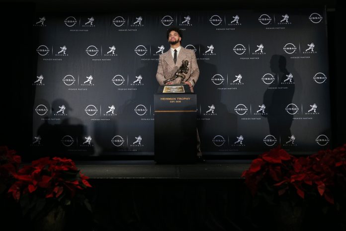 Dec 10, 2022; New York, NY, USA; Southern California quarterback Caleb Williams poses with his 2022 Heisman Trophy during a press conference in the Astor Ballroom at the New York Marriott Marquis in New York, NY. Mandatory Credit: Brad Penner-USA TODAY Sports