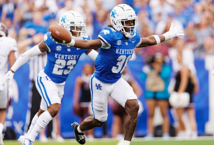 Sep 9, 2023; Lexington, Kentucky, USA; Kentucky Wildcats defensive back Maxwell Hairston (31) celebrates an interception during the second quarter against the Eastern Kentucky Colonels at Kroger Field. Mandatory Credit: Jordan Prather-USA TODAY Sports