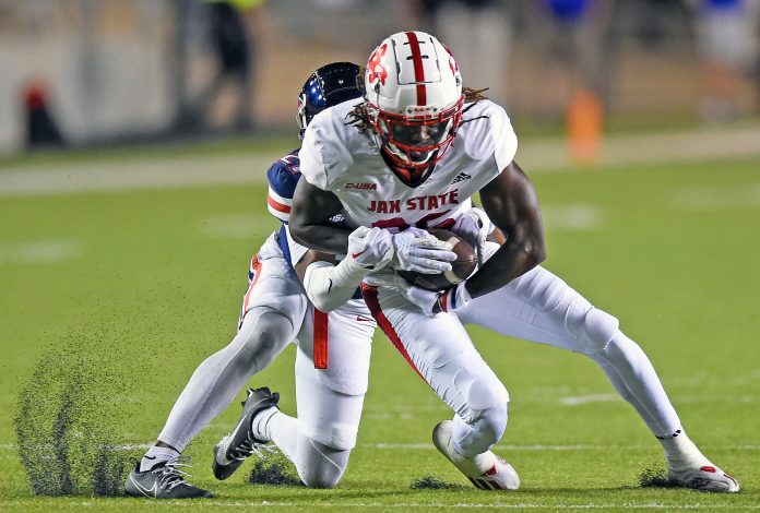 Jacksonville State's Ron Wiggins tries to evade the tackle of Liberty's Marquis Bell during college football action at Burgess-Snow Field Jacksonville State Stadium in Jacksonville, Alabama October 10, 2023. (Dave Hyatt: Hyatt Media LLC)