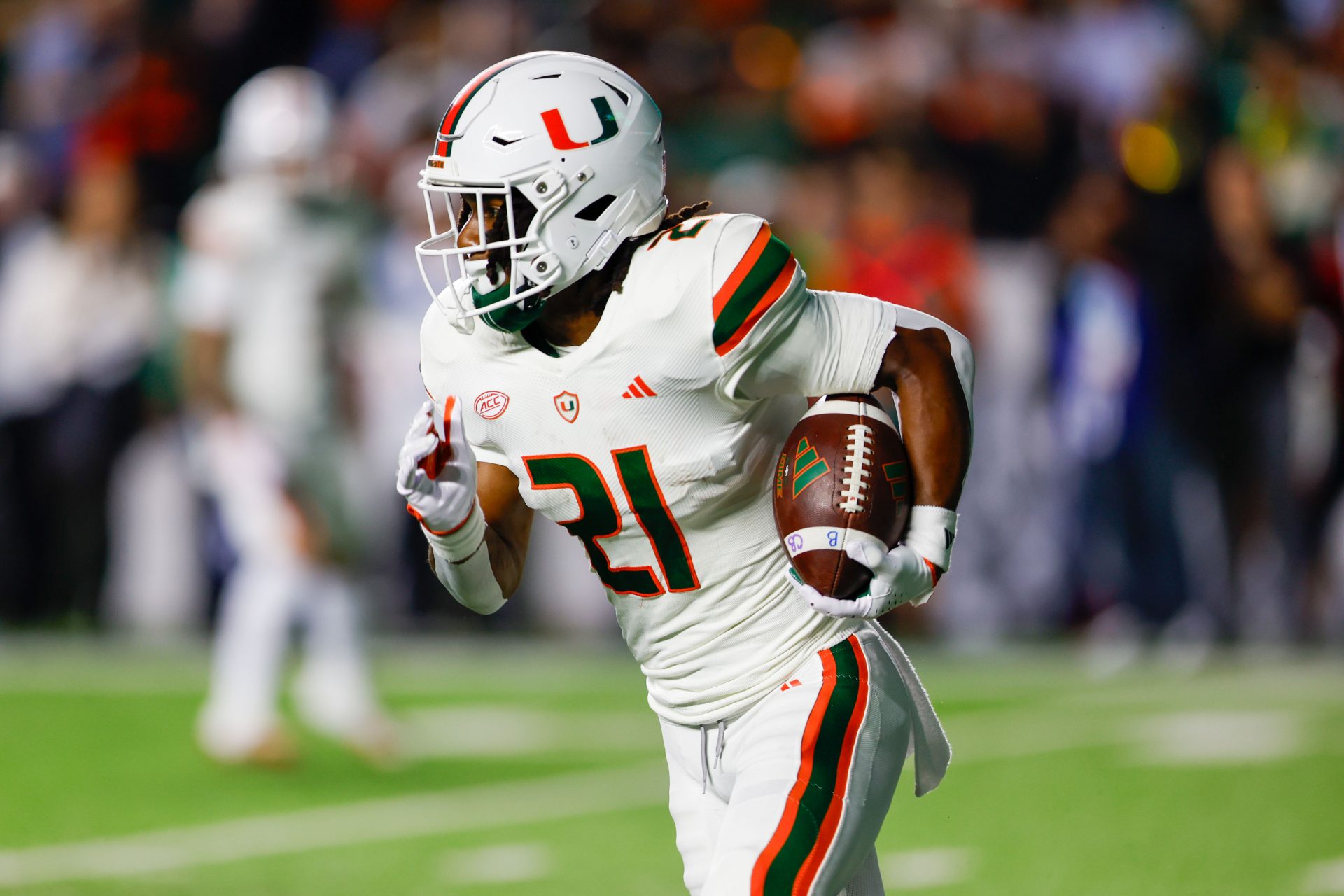 Oct 14, 2023; Chapel Hill, North Carolina, USA; Miami Hurricanes running back Henry Parrish Jr. (21) carries the football against the North Carolina Tar Heels in the first half at Kenan Memorial Stadium. Mandatory Credit: Nell Redmond-USA TODAY Sports