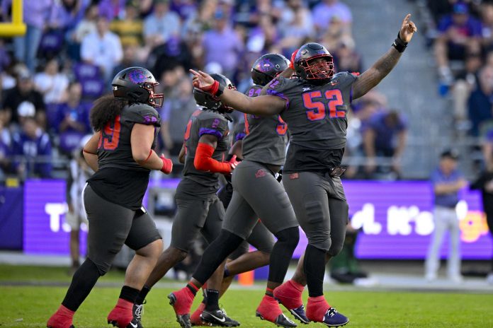 Nov 18, 2023; Fort Worth, Texas, USA; TCU Horned Frogs defensive lineman Damonic Williams (52) and the Frogs defense celebrate after making a defensive stop against the Baylor Bears during the second half at Amon G. Carter Stadium. Mandatory Credit: Jerome Miron-USA TODAY Sports