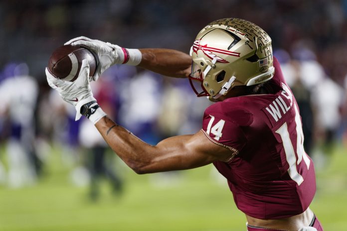 Nov 18, 2023; Tallahassee, Florida, USA; Florida State Seminoles wide receiver Johnny Wilson (14) catches the ball during the warm ups against the North Alabama Lions at Doak S. Campbell Stadium. Mandatory Credit: Morgan Tencza-USA TODAY Sports