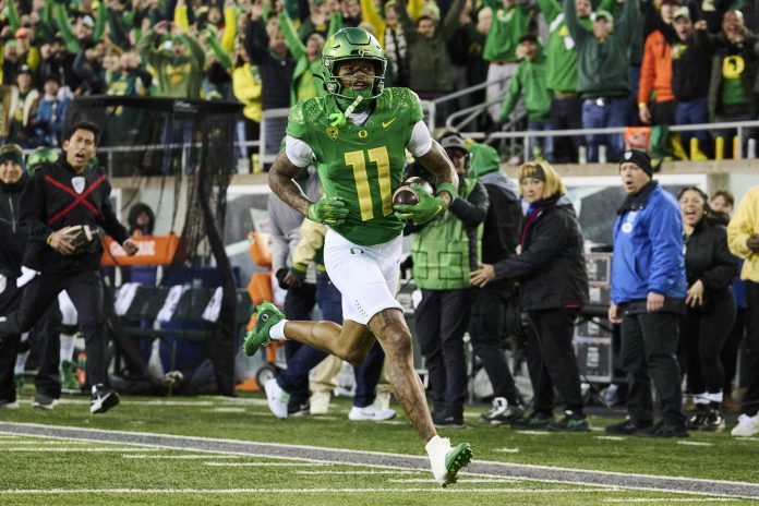 Nov 24, 2023; Eugene, Oregon, USA; Oregon Ducks wide receiver Troy Franklin (11) catches a pass for a touchdown during the first half against the Oregon State Beavers at Autzen Stadium. Mandatory Credit: Troy Wayrynen-USA TODAY Sports
