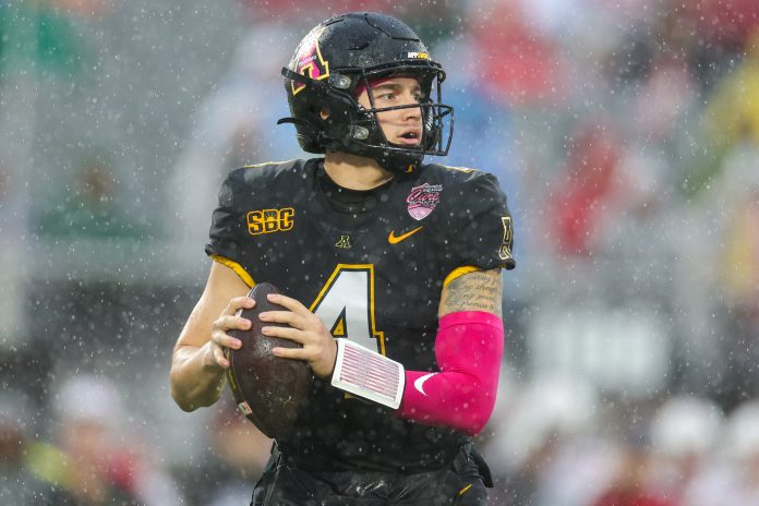 Dec 16, 2023; Orlando, FL, USA; Appalachian State Mountaineers quarterback Joey Aguilar (4) drops back to pass against the Miami (OH) Redhawks in the first quarter during the Avocados from Mexico Cure Bowl at FBC Mortgage Stadium. Mandatory Credit: Nathan Ray Seebeck-USA TODAY Sports