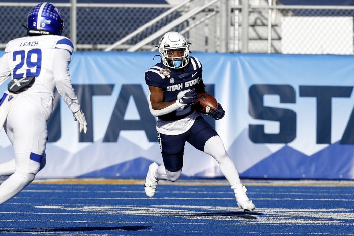 Dec 23, 2023; Boise, ID, USA; Utah State Aggies running back Davon Booth (6) during the first half against the Georgia State Panthers at Albertsons Stadium. Mandatory Credit: Brian Losness-USA TODAY Sports