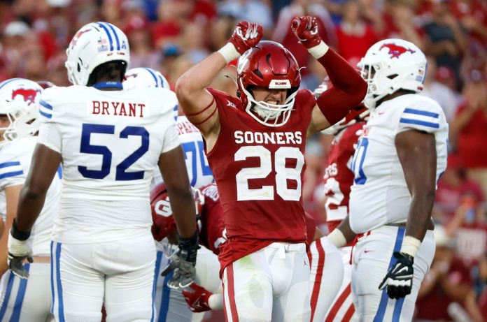 Oklahoma's Danny Stutsman (28) celebrates a play next to SMU's Sean Kane (52) in the second half of the college football game between the University of Oklahoma Sooners and the Southern Methodist University Mustangs at the Gaylord Family Oklahoma Memorial Stadium in Norman, Okla., Saturday, Sept. 9, 2023.