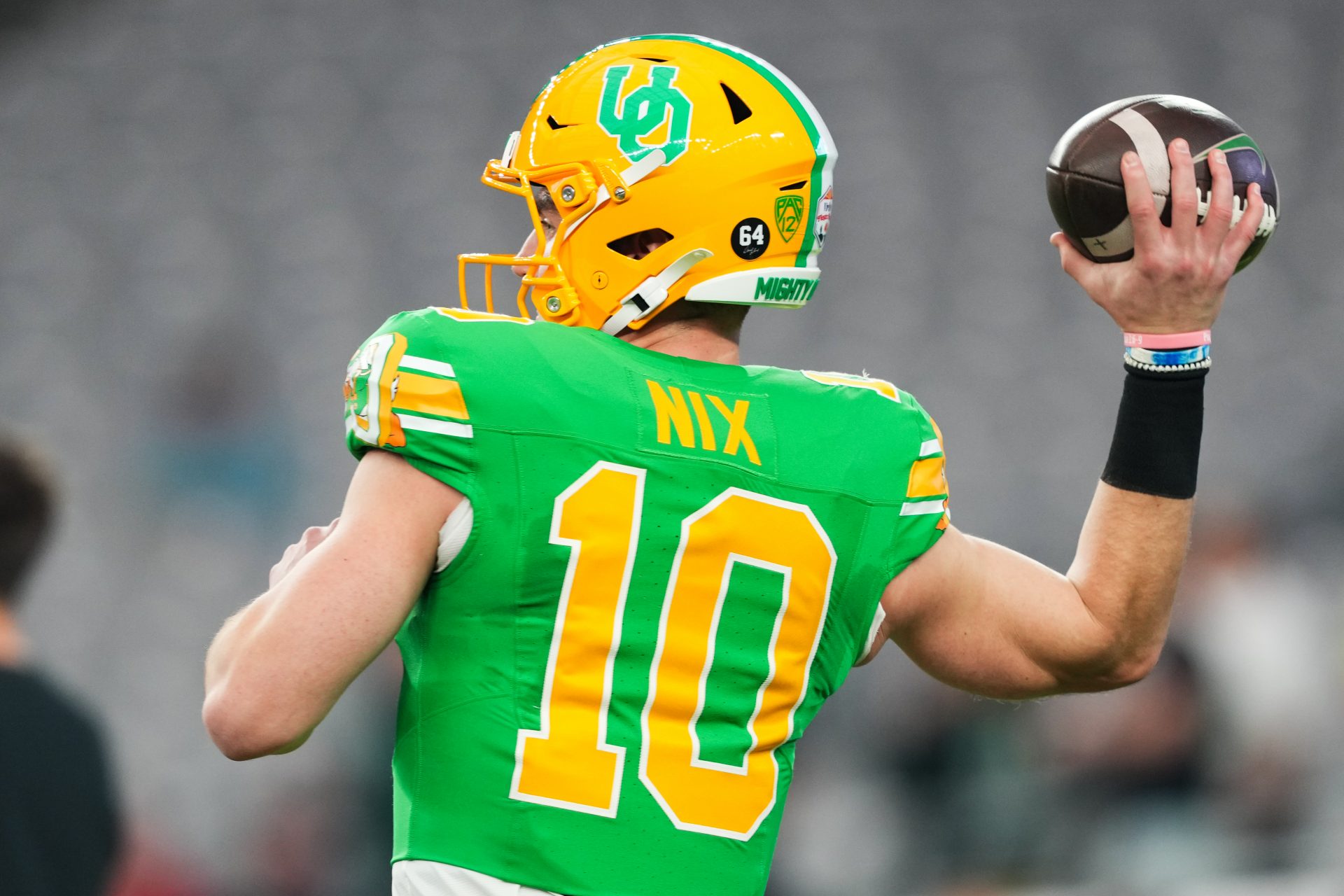 Jan 1, 2024; Glendale, AZ, USA; Oregon Ducks quarterback Bo Nix (10) throws during warm ups before the 2024 Fiesta Bowl against the Liberty Flames at State Farm Stadium. Mandatory Credit: Joe Camporeale-USA TODAY Sports