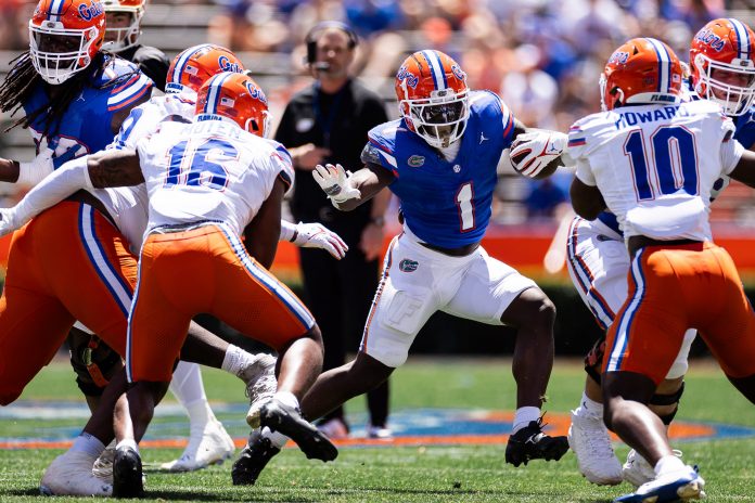 Florida Gators running back Montrell Johnson Jr. (1) rushes with the ball during the first half at the Orange and Blue spring football game at Steve Spurrier Field at Ben Hill Griffin Stadium in Gainesville, FL on Saturday, April 13, 2024. [Matt Pendleton/Gainesville Sun]