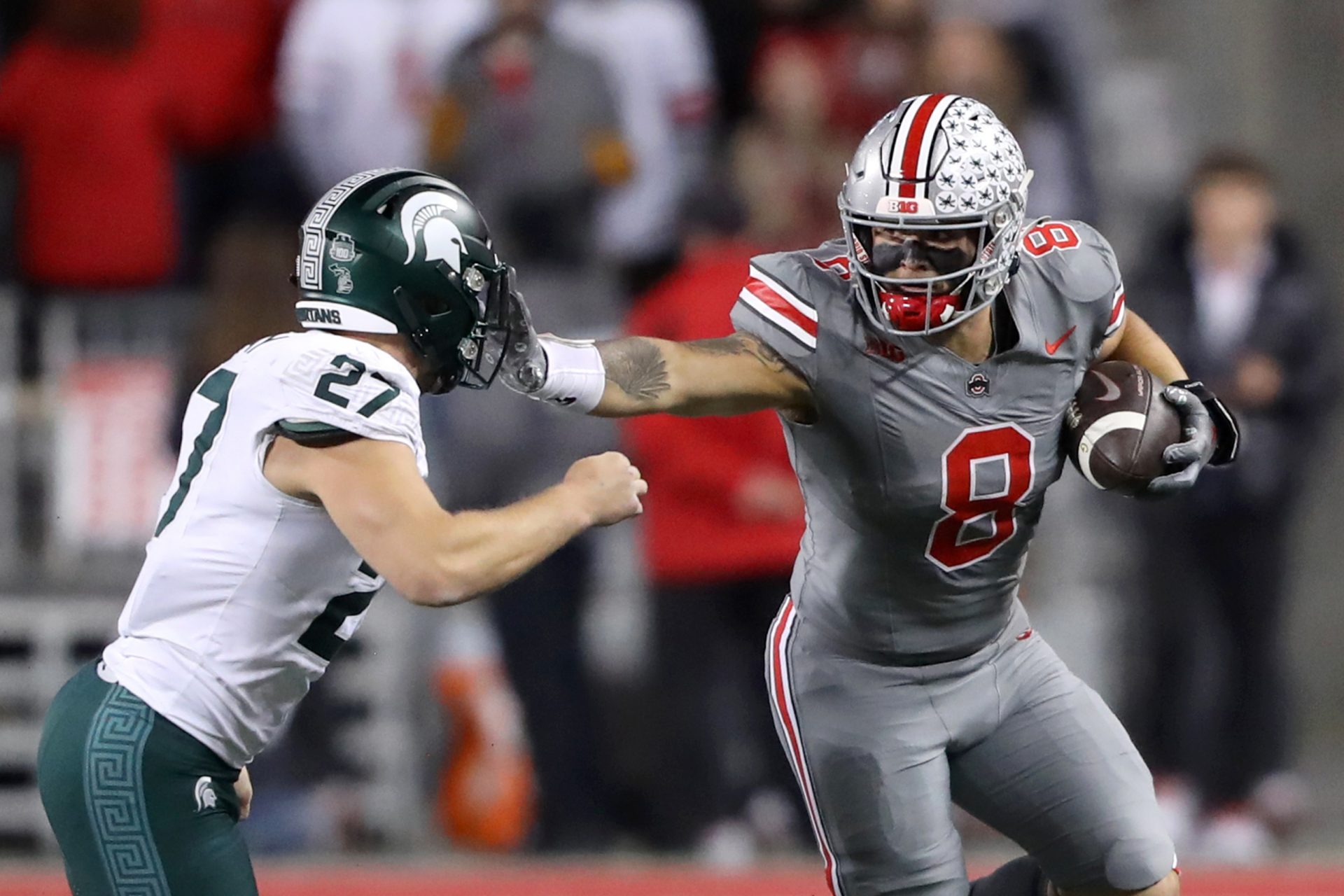 Ohio State Buckeyes tight end Cade Stover (8) catches the football as Michigan State Spartans linebacker Cal Haladay (27) makes the tackle during the first quarter at Ohio Stadium. Mandatory Credit: Joseph Maiorana-USA TODAY Sports