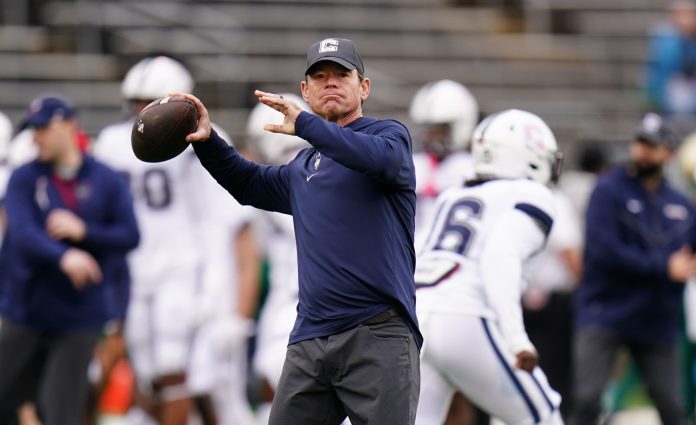 Oct 21, 2023; East Hartford, Connecticut, USA; UConn Huskies head coach Jim Mora on the field before the start of the game against the South Florida Bulls at Rentschler Field at Pratt & Whitney Stadium.