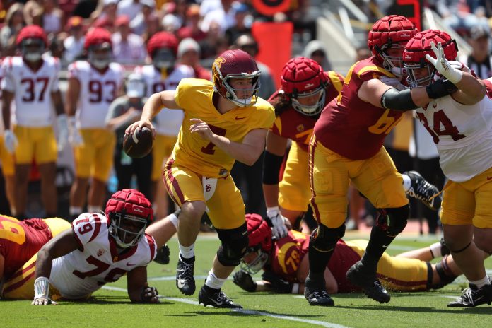 USC Trojans quarterback Miller Moss (7) scrambles from defense during the Spring Game at Los Angeles Memorial Coliseum.
