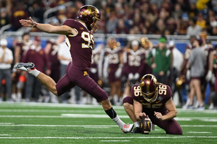 Minnesota Golden Gophers place kicker Dragan Kesich (99) kicks a field goal against the Bowling Green Falcons in the second quarter at Ford Field.