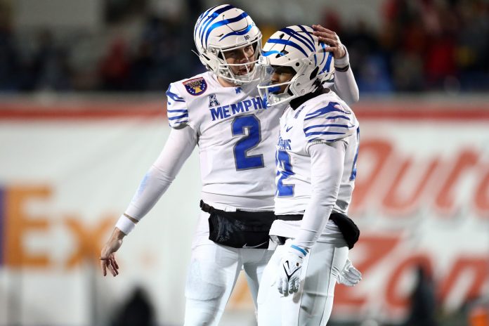 Memphis Tigers quarterback Seth Henigan (2) reacts with Memphis Tigers running back Brandon Thomas (22) during the second half against the Iowa State Cyclones at Simmons Bank Liberty Stadium.