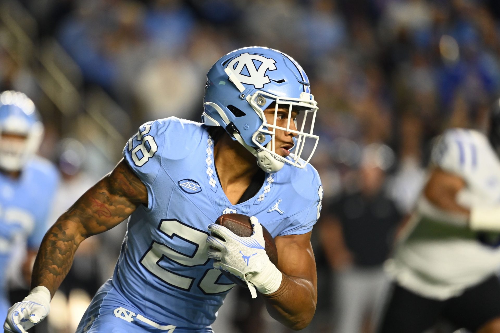 North Carolina Tar Heels running back Omarion Hampton (28) with the ball in the first quarter at Kenan Memorial Stadium.