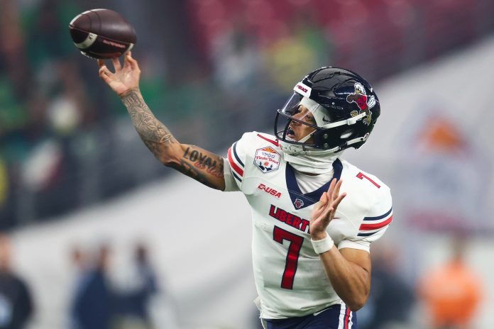 Liberty Flames quarterback Kaidon Salter (7) throws against the Oregon Ducks during the first quarter of the 2024 Fiesta Bowl at State Farm Stadium.