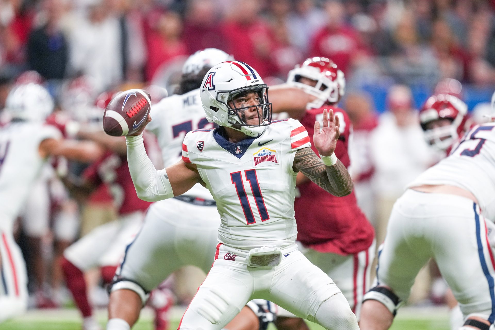 Arizona Wildcats quarterback Noah Fifita (11) throws a pass in the first half against the Oklahoma Sooners at Alamodome.