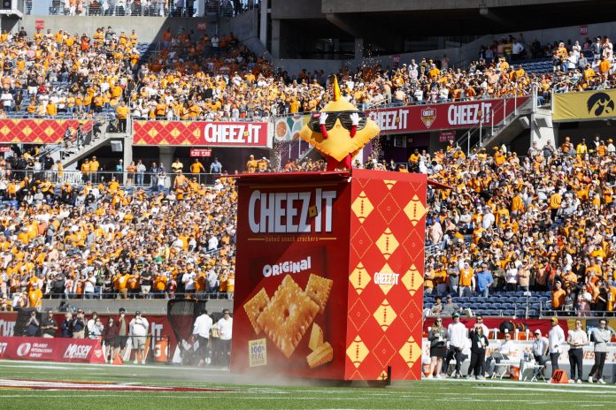 The Cheez-It Bowl mascot comes out of his box before the game between the Tennessee Volunteers and the Iowa Hawkeyes at Camping World Stadium.