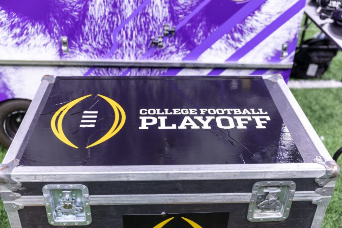 A general view of the College Football Playoff logo on a case on the Washington Huskies sideline before the 2024 Sugar Bowl college football playoff semifinal game between the Texas Longhorns and the Washington Huskies at Caesars Superdome.