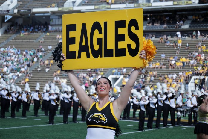 Sep 16, 2023; Hattiesburg, Mississippi, USA; A Southern Miss Golden Eagles cheerleader performs before their game against the Tulane Green Wave at M.M. Roberts Stadium. Mandatory Credit: Chuck Cook-USA TODAY Sports