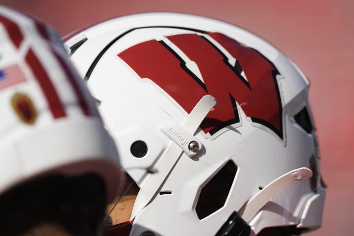 Oct 7, 2023; Madison, Wisconsin, USA; The Wisconsin logo on a helmet during warmups prior to the game against the Rutgers Scarlet Knights at Camp Randall Stadium. Mandatory Credit: Jeff Hanisch-USA TODAY Sports