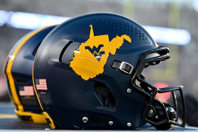 Oct 12, 2023; Houston, Texas, USA; A detailed view of a West Virginia Mountaineers helmet on the sideline during the game against the Houston Cougars at TDECU Stadium. Mandatory Credit: Maria Lysaker-USA TODAY Sports