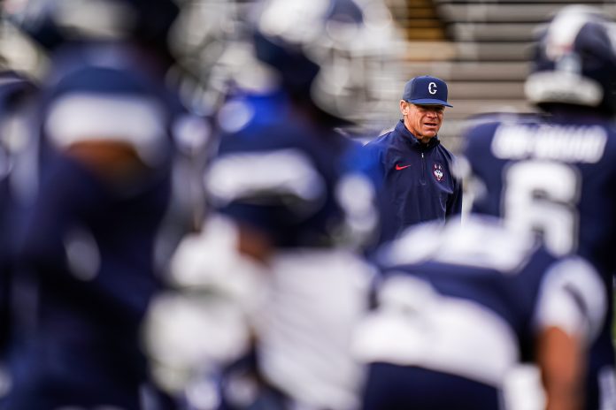 Nov 18, 2023; East Hartford, Connecticut, USA; UConn Huskies head coach Jim Mora on the field during warm ups before the game against the Sacred Heart Pioneers at Rentschler Field at Pratt & Whitney Stadium. Mandatory Credit: David Butler II-USA TODAY Sports