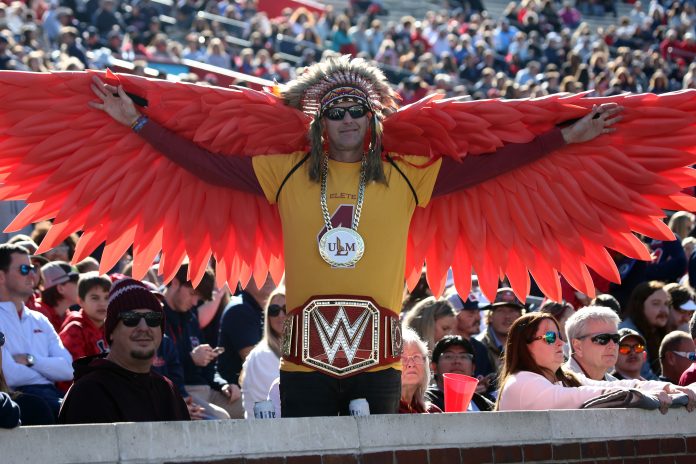Nov 18, 2023; Oxford, Mississippi, USA; Louisiana Monroe Warhawks fans cheer during the first half against the Mississippi Rebels at Vaught-Hemingway Stadium. Mandatory Credit: Petre Thomas-USA TODAY Sports
