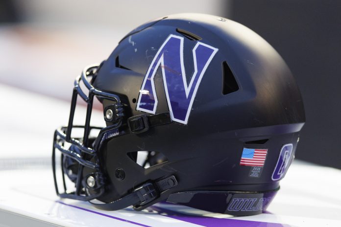 Nov 11, 2023; Madison, Wisconsin, USA; General view of a Northwestern Wildcats helmet on the sidelines during the game against the Wisconsin Badgers at Camp Randall Stadium. Mandatory Credit: Jeff Hanisch-USA TODAY Sports