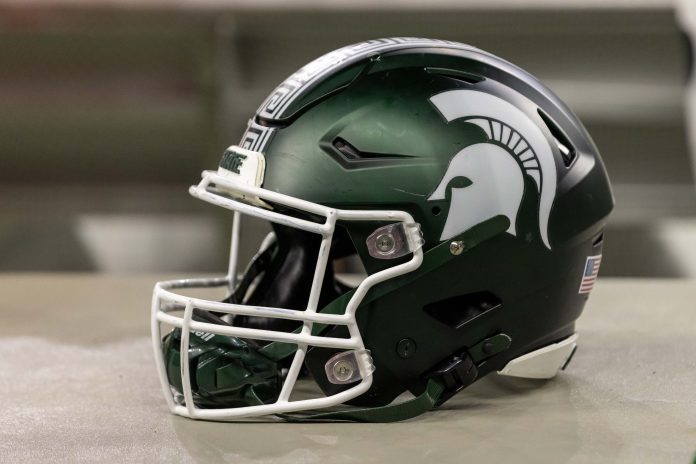 Nov 24, 2023; Detroit, Michigan, USA; A Michigan State Spartans helmet sits on a bench during the second half game against the Penn State Nittany Lions at Ford Field. Mandatory Credit: David Reginek-USA TODAY Sports