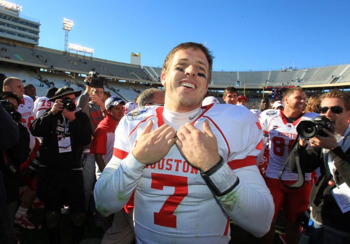 Jan 2, 2012; Dallas, TX, USA; Houston Cougars quarterback Case Keenum (7) smiles after victory against the Penn State Nittany Lions at the Cotton Bowl. The Cougars beat the Nittany Lions 30-14. Mandatory Credit: Matthew Emmons-USA TODAY Sports