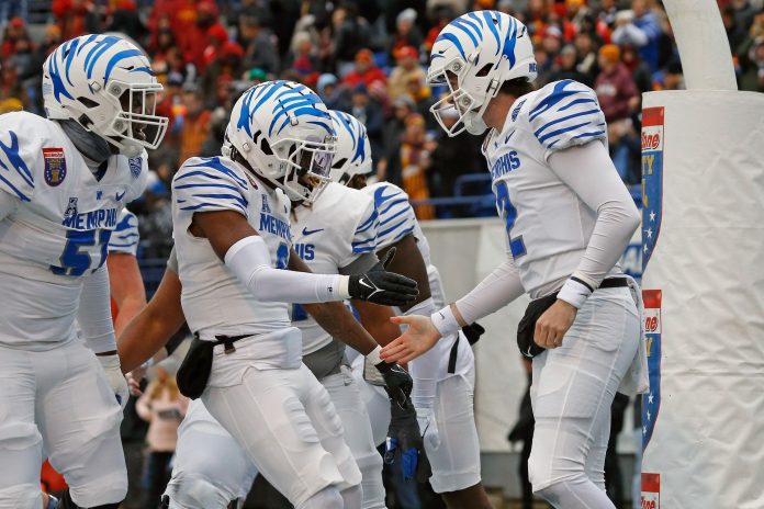 Memphis Tigers quarterback Seth Henigan (2) reacts with wide receiver Demeer Blankumsee (0) after a touchdown during the first half against the Iowa State Cyclones at Simmons Bank Liberty Stadium.