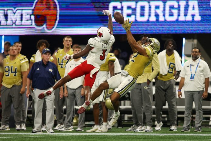 Louisville Cardinals defensive back Quincy Riley (3) breaks up a pass intended for Georgia Tech Yellow Jackets wide receiver Dominick Blaylock (12) in the fourth quarter at Mercedes-Benz Stadium.