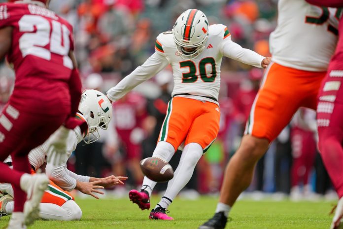 Miami Hurricanes place kicker Andres Borregales (30) kicks an extra point in the first quarter against the Temple Owls at Lincoln Financial Field.