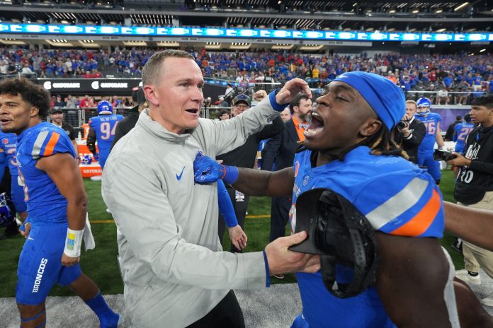 Boise State Broncos head coach Spencer Danielson celebrates with running back Ashton Jeanty (2) after 44-20 victory over the UNLV Rebels in the Mountain West Championship at Allegiant Stadium.