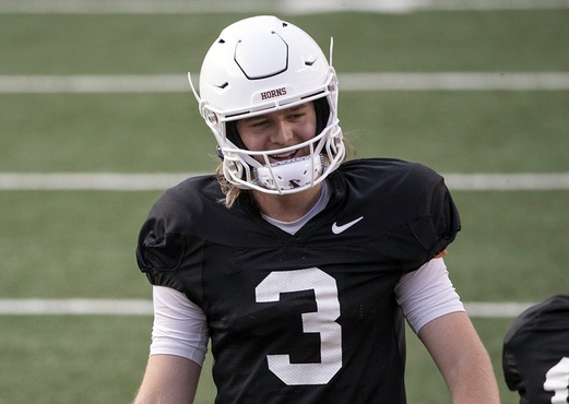 Texas Longhorns quarterback Quinn Ewers (3) listens to instructions during spring practice at DKR Memorial Stadium on Tuesday, April 5, 2022.