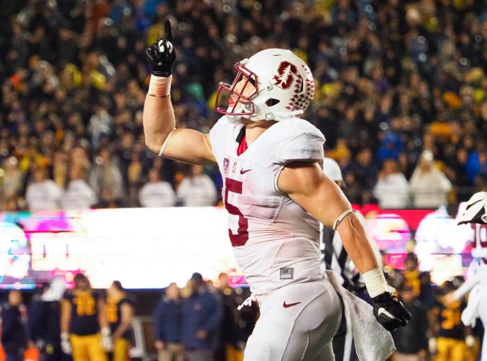 Stanford Cardinal running back Christian McCaffrey (5) points to the sky in celebration after a touchdown against the California Golden Bears during the fourth quarter at Memorial Stadium.