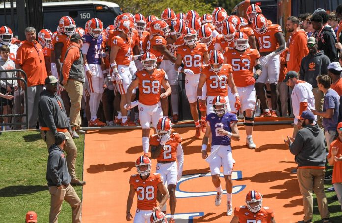 Clemson quarterback Cade Klubnik (2) and teammates run down the hill before the Spring football game in Clemson.