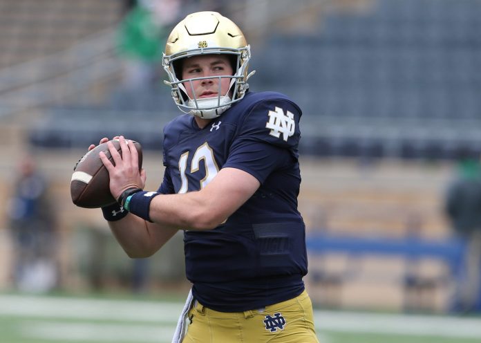 Notre Dame quarterback Riley Leonard (13) who is hurt, dresses and throws some pre-game passes with fellow quarterbacks Saturday, April 20, 2024, at the annual Notre Dame Blue-Gold spring football game at Notre Dame Stadium in South Bend.
