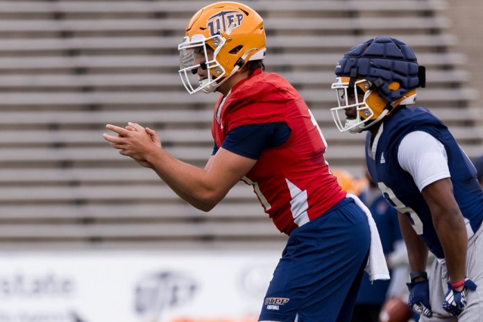 UTEP Miners QB Cade McConnell (11) takes a snap during team drills.