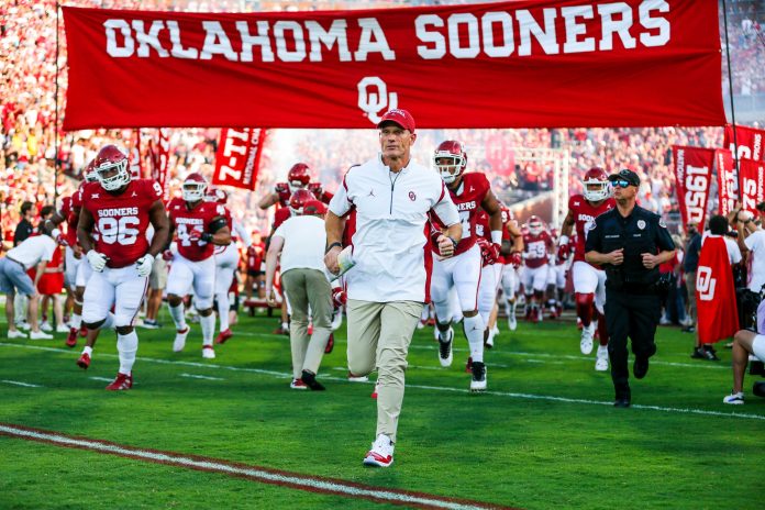 Brent Venables runs on the field before an NCAA football game between University of Oklahoma (OU) and Iowa State at the Gaylord Family Oklahoma Memorial Stadium in Norman.