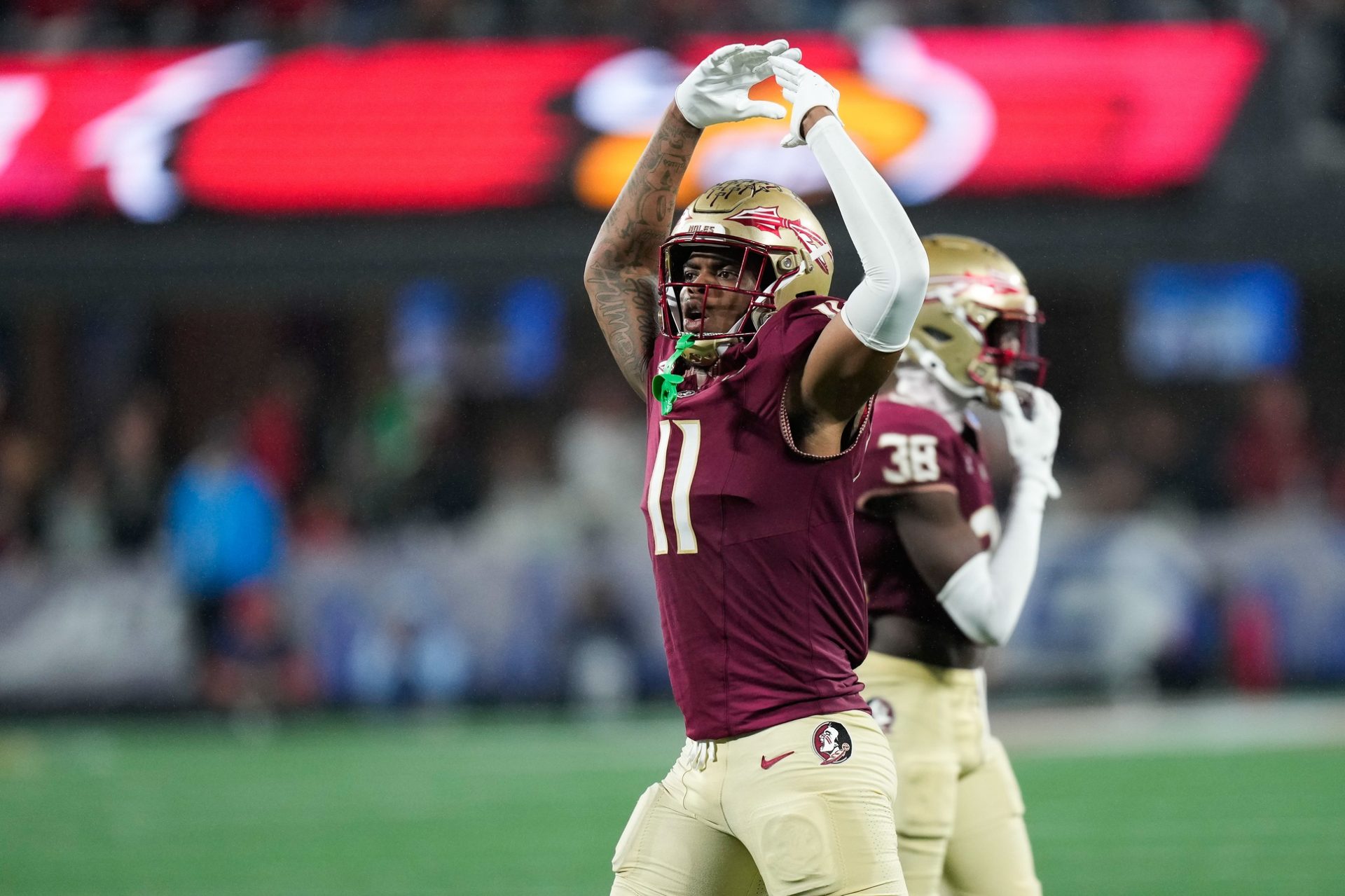 Florida State Seminoles defensive lineman Patrick Payton (11) reacts during the fourth quarter against the Louisville Cardinals at Bank of America Stadium.