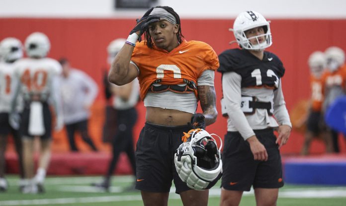 Oklahoma State Cowboys running back Ollie Gordon II (0) practices at the University of Houston indoor Facility.