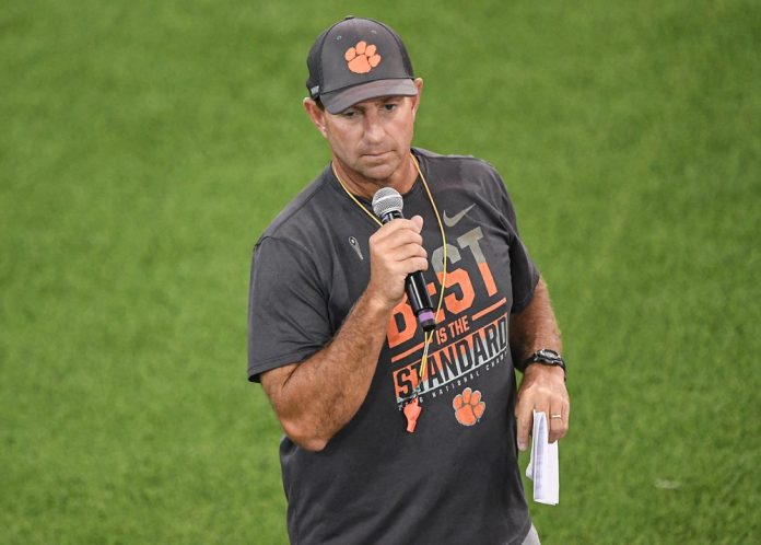 Clemson head coach Dabo Swinney talks with participants during the 2024 Dabo Swinney Football Camp.