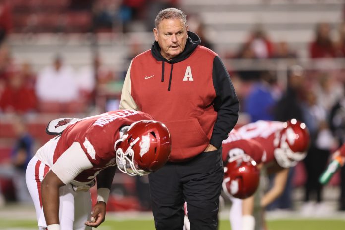 Nov 18, 2023; Fayetteville, Arkansas, USA; Arkansas Razorbacks head coach Sam Pittman talks to quarterback KJ Jefferson (1) prior to the game against the FIU Panthers at Donald W. Reynolds Razorback Stadium. Mandatory Credit: Nelson Chenault-USA TODAY Sports